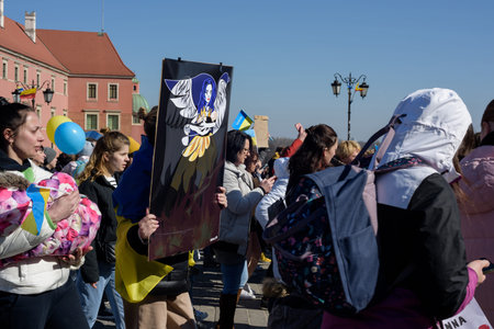 Warsaw. Poland. Castle Square. 03.18.2022. Anti-war rally of Ukrainian women whose husbands remained in Ukraine.のeditorial素材