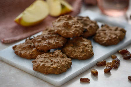 Homemade cookies on a white cutting board.の写真素材
