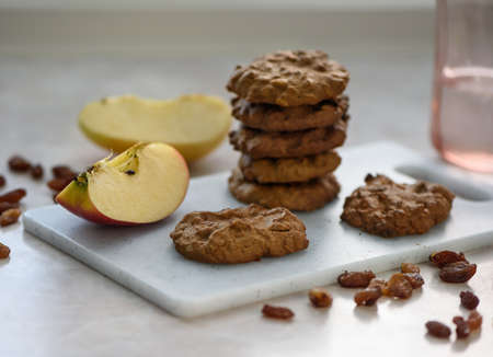 Homemade cookies on a white cutting board.の写真素材