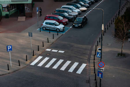 Warsaw. Poland. 03.30.2022. Urban landscape. Top view. Crossing roads and cars in the parking lot.のeditorial素材