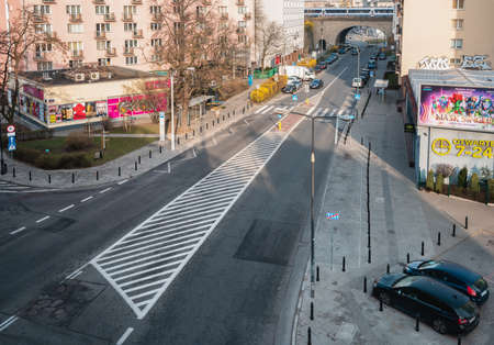 Warsaw. Poland. 03.30.2022. Urban landscape. Top view. Crossing roads and cars in the parking lot.のeditorial素材