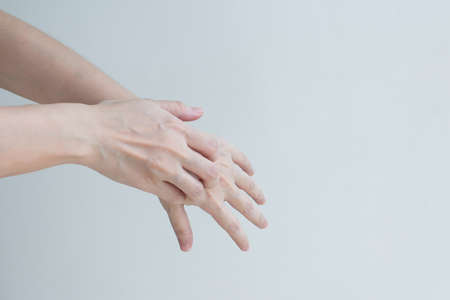 woman' hand are itching and scratching of skin diseases. Concept with Healthcare And Medicine.の写真素材