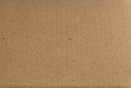 Close up brown paper box carton with a bit rough and grooving which made from recycle paper....