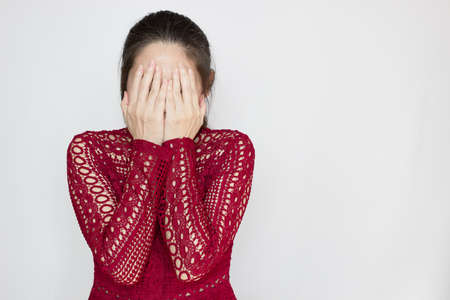 Asian beautiful woman sit on sofa in living room and stretch with laptop after finish a conference, working .の写真素材