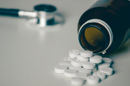 White medicine was pour from bottle with stethoscope for cure  a patentの写真素材