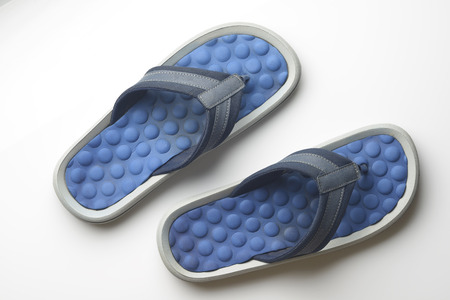 Blue Flipflop on White Background Shot In Studio.の写真素材