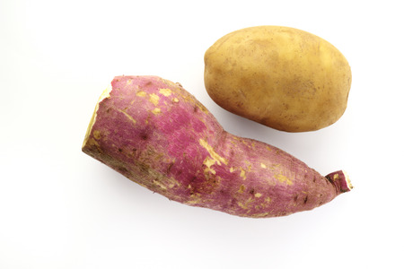 Sweet and Brown Potatoes on White Backgroundの写真素材