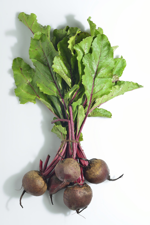 Bunch of Beetroot with Green Leafs on White Backgroundの写真素材