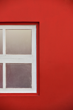 White Wooden Window With Glass Pane In Red Wallの写真素材