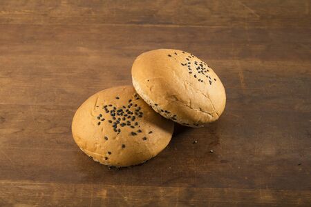 Food: Whole Wheat Bun Isolated on Wooden Backgroundの写真素材