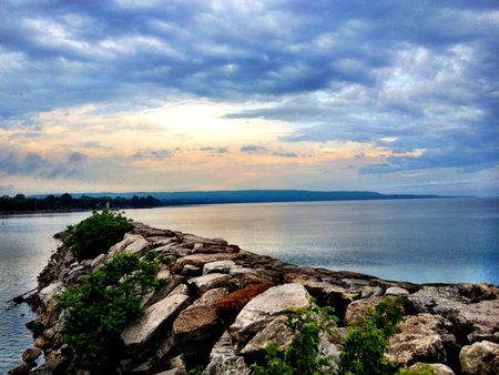 View of lake from rocks at sunset