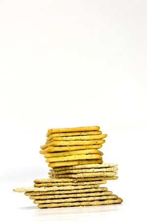 Stack of crackers on white backgroundの写真素材