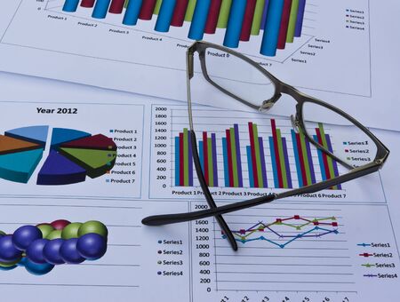 Glass on Collection of graph report paperの写真素材