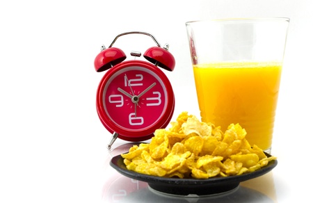 cornflakes,orange juice and alamclock ,concept times to breakの写真素材
