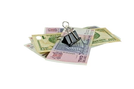 Banknote and paper clip on top , isolated on white backgroundの写真素材