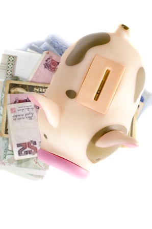Piggy bank and banknotes , isolated on white backgroundの写真素材