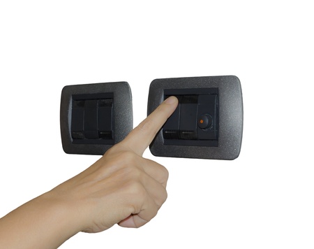 Finger turning switch on or off ,isolated on white backgroundの写真素材