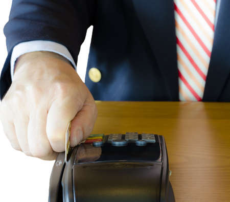 Businessman using credit card in credit card machineの写真素材