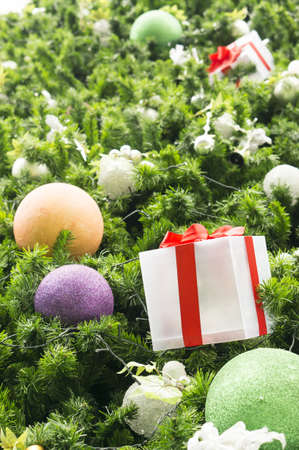 Decorative Christmas balls and gift box on Christmas tree,selective focusの写真素材