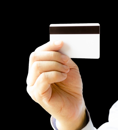 hand holding blank credit card , isolated on black backgroundの写真素材