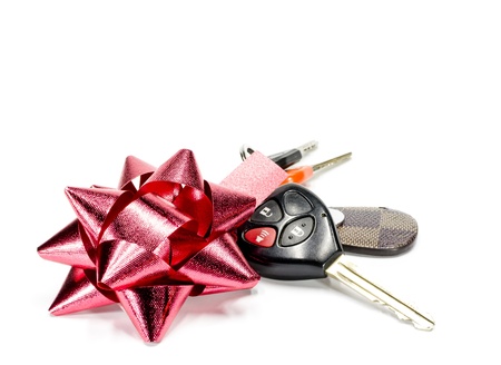 Car key and  ribbon,isolated on white backgroundの写真素材