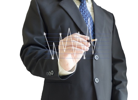 Business man drawing a line graph on virtual screen,isolated on white backgroundの写真素材