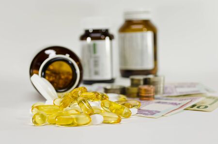 Pill,Pill Bottle and Money,concept for Healthcare, medicine and expensesの写真素材