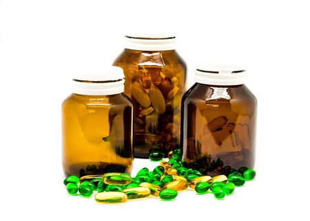 Pill Bottle and drug pills , isolated on white backgroundの写真素材