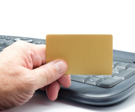 hand holding blank credit card and computer keyboard , Concept for online shoppingの写真素材