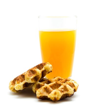 Waffles and orange juice ,isolated on white backgroundの写真素材