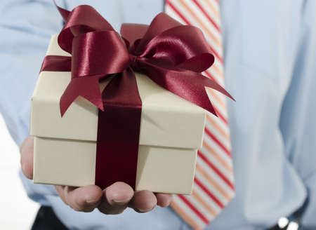 Businessman showing gift box ,Concept for celebrationの写真素材
