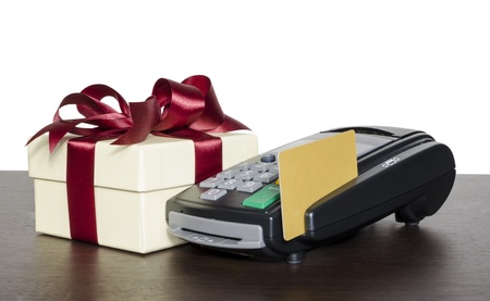 Credit card eader machine and gift box , isolated on white backgroundの写真素材