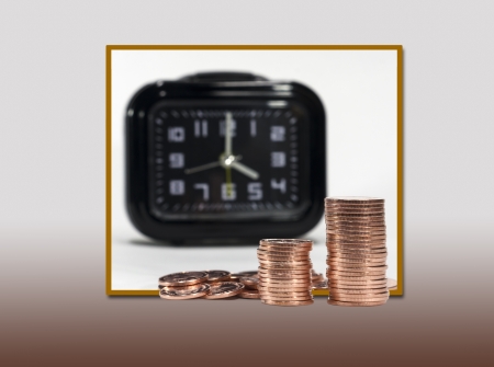 copper coins and alarm clock , isolated on white backgroundの写真素材