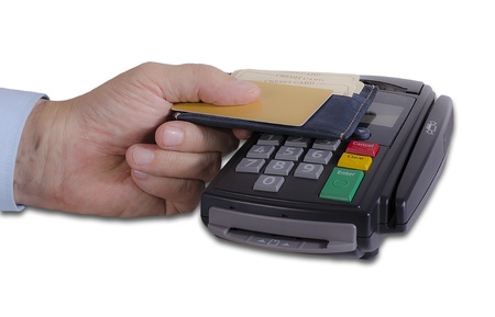 Hand showing credit card on credit card reader machineの写真素材