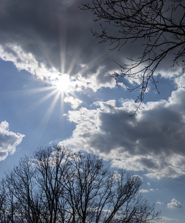 dark sky with sun light coming through the cloud  and sun beamの写真素材