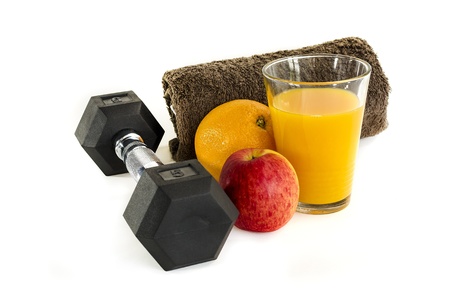Black gym dumbbell , towel and orange juice, isolated on white background.の写真素材