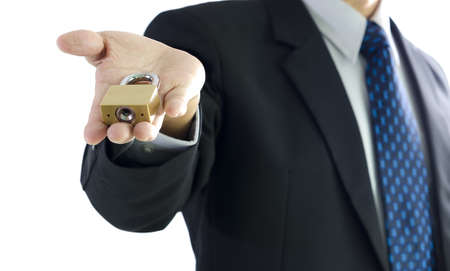 Business man with master key on hand, isolated on white backgroundの写真素材