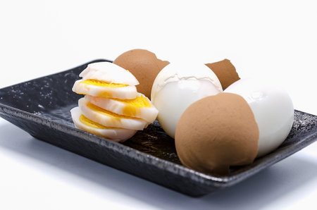 Sliced boiled eggs , isolated on white backgroundの写真素材