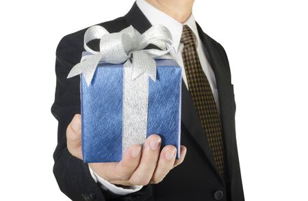 Businessman holding gift box isolated on white backgroundの写真素材