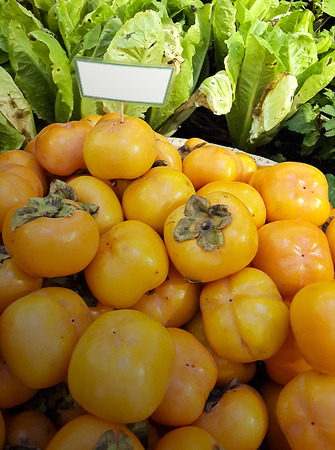Background of fresh persimmon in the marketの写真素材