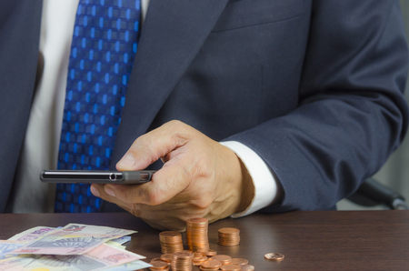 Businessman using mobile phone on workingの写真素材