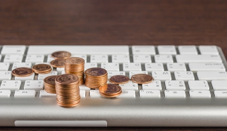 Computer keyboard and coins :Concept for make money from webの写真素材