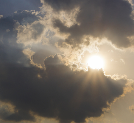 Sunbeam and cloudy skyの写真素材