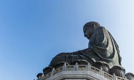 The Tian Tan Buddha in Hong Kong under blue sky の写真素材
