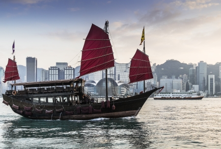 view of Hong Kong's Vicotria harbor with junk boatのeditorial素材