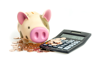 Piggy bank and Coins with calculator,Isolated on white backgroundの写真素材