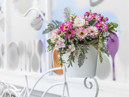 decorative the bicycle with artificial flowers on color wall backgroundの写真素材