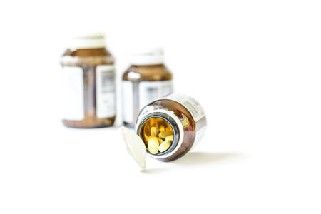 Drugs pills and dietary supplement capsules on white backgroundの写真素材