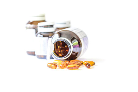 Drugs pills and dietary supplement capsules on white backgroundの写真素材