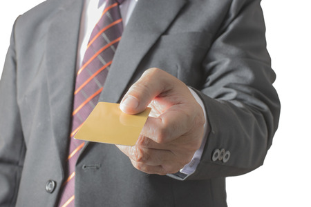 Image of hands paying using credit card, isolated on white backgroundの写真素材